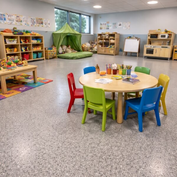 Childcare epoxy flooring Perth centre interior with non-slip, easy-clean epoxy floor by Epoxy Flooring Guys Perth.